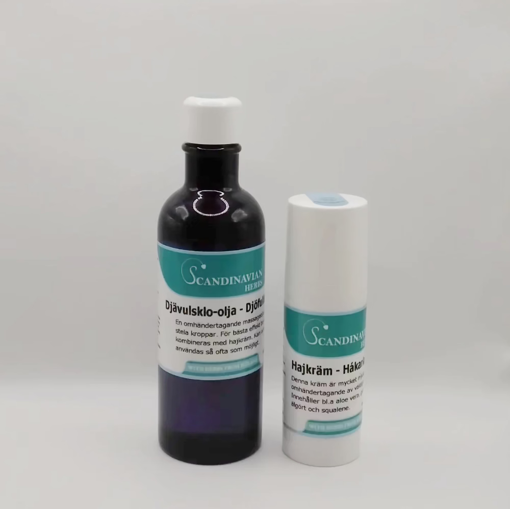 Two Scandinavian Herbs products: a dark blue bottle labeled Djävulsklo-olja with a white cap on the left, and a white cylindrical container labeled Hajkräm for ledsmärta on the right. Both have teal labels with white text, blending tradition with soothing relief in the Friskvårdspaket - för stela och ömma leder.