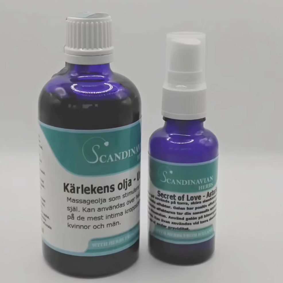Two blue bottles with white caps and Swedish labels stand out. The larger is Kärlekens olja, known for its afrodisiaka effekter, and the smaller is Secret of Love. Offered by Scandinavian Herbs in their Kärlekspaket- en relationshöjare, they’re ideal for an enchanting massage experience.