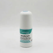 A white cylindrical deodorant bottle labeled Deodorant - naturlig och aluminiumfri by Scandinavian Herbs, meant for känslig hud and made with naturliga ingredienser, sits beside a whole yellow lemon on a white background.