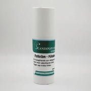 A white bottle of Scandinavian Herbs Fotkräm, with a teal label, features Swedish text detailing its efficacy against foot odor and tired feet. Its a softening and lightly absorbed cream for försiktig fotvård, infused with Icelandic herbs.