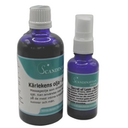 Two blue bottles with white caps and Swedish labels stand out. The larger is Kärlekens olja, known for its afrodisiaka effekter, and the smaller is Secret of Love. Offered by Scandinavian Herbs in their Kärlekspaket- en relationshöjare, they’re ideal for an enchanting massage experience.